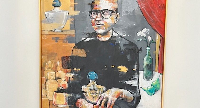 A portrait of the founder, Sudhir Gupta, with his first and most-prized bottle.